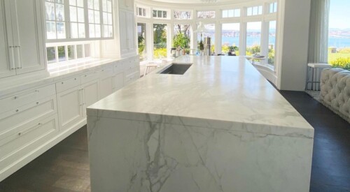 A waterfall marble countertop with a protection sealer by TuffSkin Surface Protection.