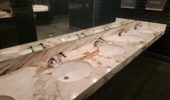A marble sink countertop in a restaurant.